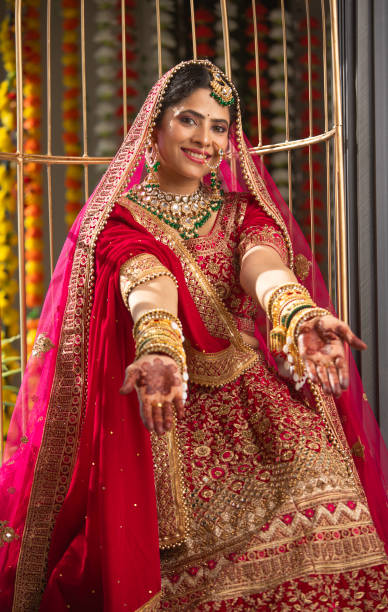 istock Happy bride showing henna tattoo in wedding ceremony 2200860213