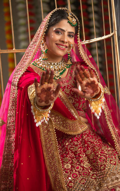 istock Happy bride showing henna tattoo in wedding ceremony 2200860261