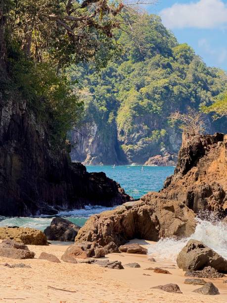 istock Tropical Teluk Ijo Beach with Rocky Cliffs and Clear Blue Sky 2200860346