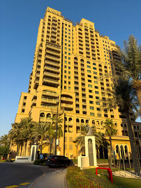 istock multi-storey yellow apartment building 2200865793