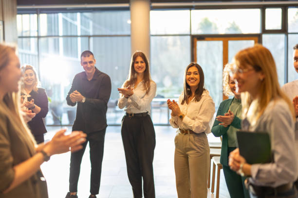 istock Businesspeople applauding during conference 2200866009