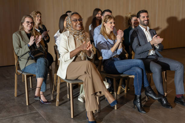istock Businesspeople applauding during conference 2200866611