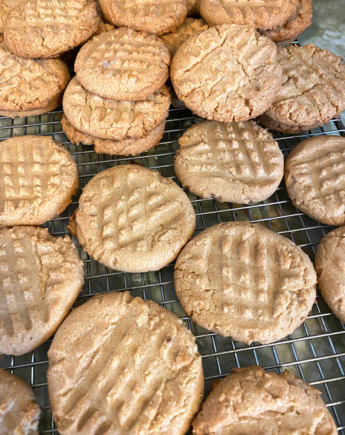 istock Homemade Peanut Buter Cookies Cooking On A Rack 2200867310