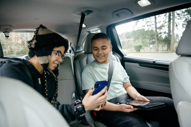 istock Kids Using Tech While Riding in Family Vehicle 2200868439