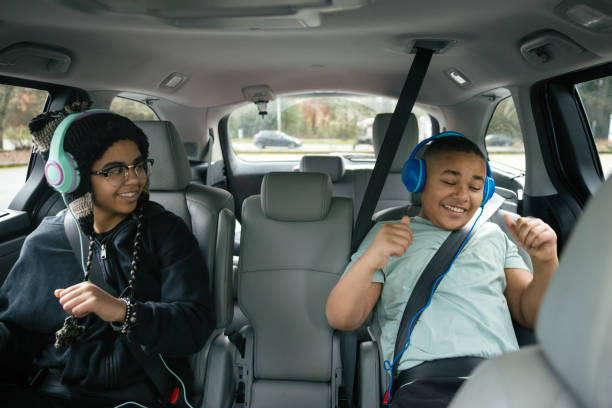 Kids Using Tech While Riding in Family Vehicle