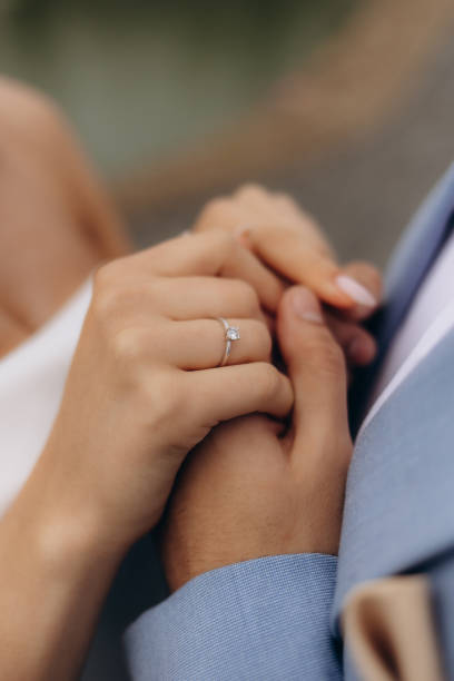 istock The bride and groom hold hands 2200868685
