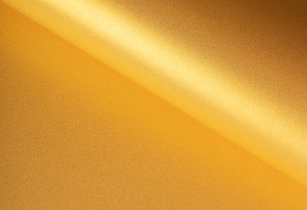 istock Gold paper background with a shiny, glossy surface and smooth gradient. Elegant and luxurious 2200869879