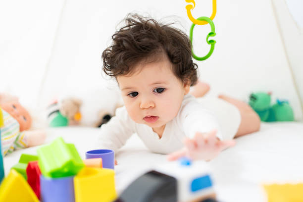 istock Cute Portrait of a Crawling Baby 2200870526