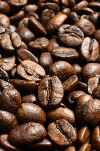 istock Organic coffee beans detailed texture close up 2200870704