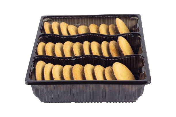 istock container with round cookies with chocolate, isolated from background 2200871252