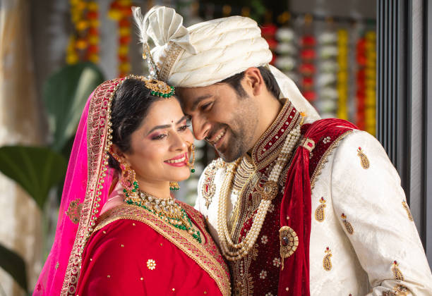istock Loving groom looking at bride in wedding ceremony 2200873482