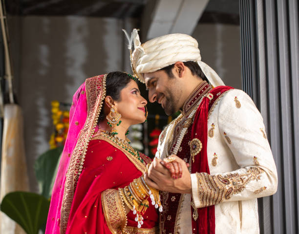 istock Loving groom looking at bride in wedding ceremony 2200873674