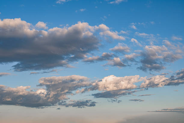 istock clouds and dramatic sky at sunset. partly cloudy weather. 2200874028