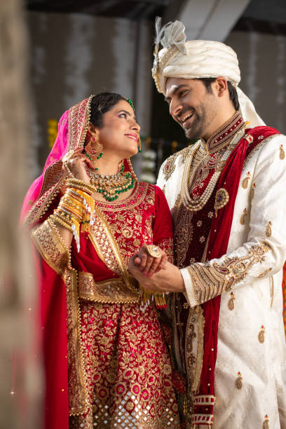 istock Loving groom looking at bride in wedding ceremony 2200874881