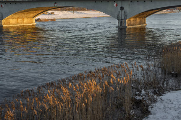 istock Under the bridge over the river in winter 2200875170
