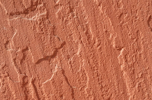 istock Facing stone of rough red sandstone closeup 2200875886