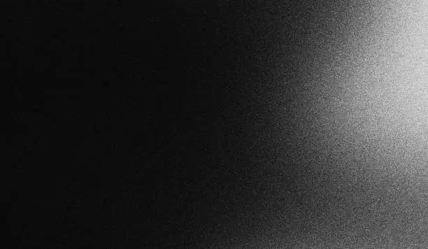 Grainy gradient black and white abstract dark retro monochrome background with noise texture Grainy gradient black and white abstract dark retro monochrome background with noise texture