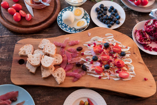 Sweet and sour butter board with parma ham and baguette slices