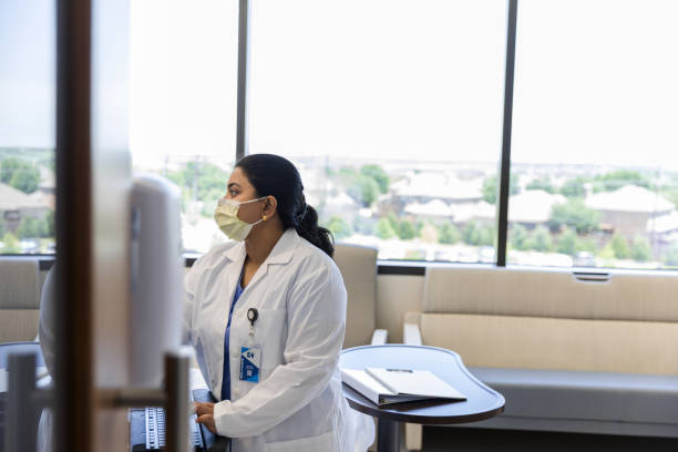 istock Female Doctor Using Laptop in Medical Office 2200879601