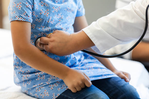 istock Doctor using stethoscope on child patient during medical exam 2200879612