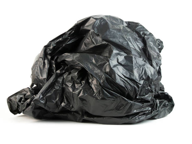 istock Crumpled black trash bag on a white background 2200879745