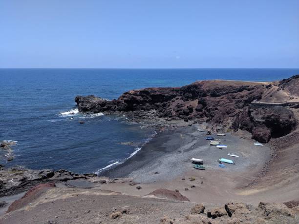 istock Boats on the rocky shore 2200881506
