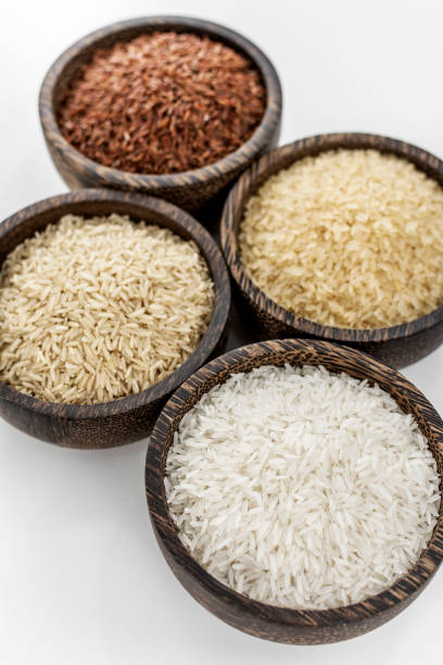 istock different kinds of asian rice grains in bowls on white background 2200882146