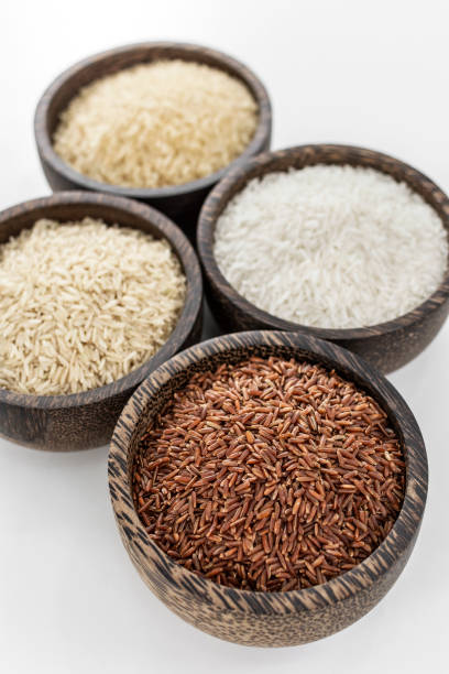 istock different kinds of asian rice grains in bowls on white background 2200882148
