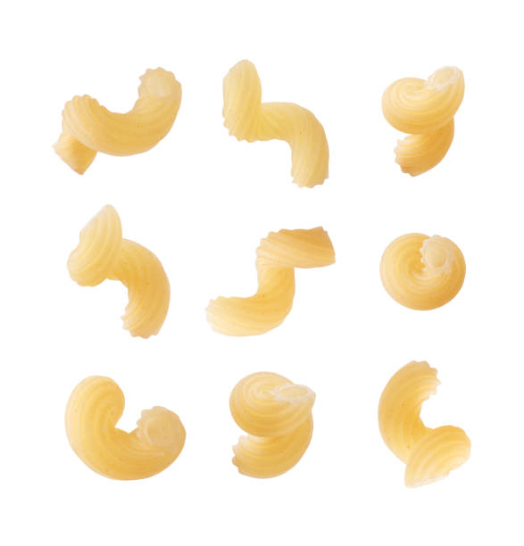 istock Set of raw twisted pasta close up isolated on a white background 2200884712