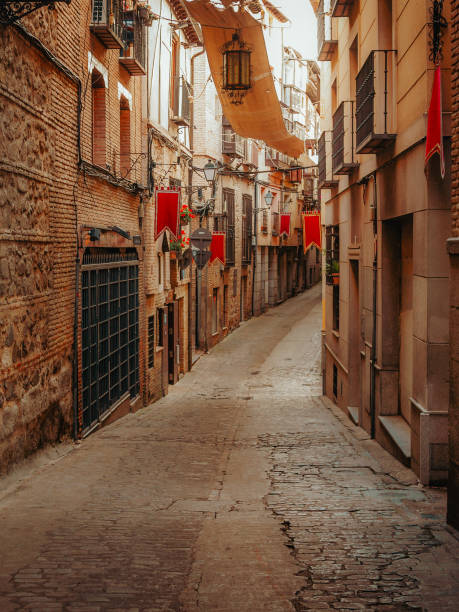 istock Charming spring afternoon on Calle Alfileritos in Toledo, Spain 2200886872