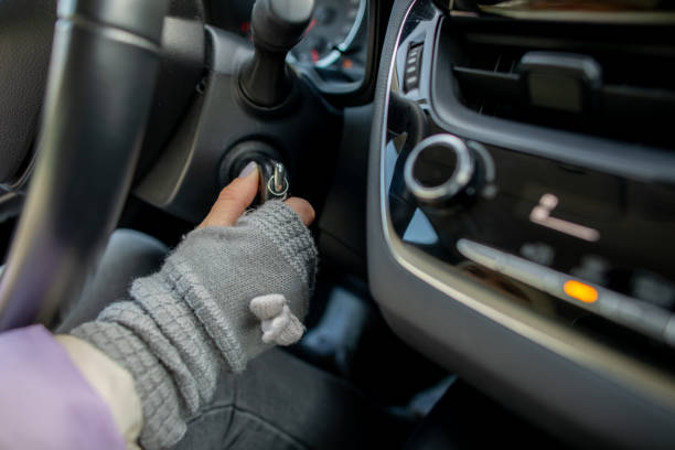 Starting a Car CloseUp on Ignition with a Gloved Hand, Ready for the Journey Ahead