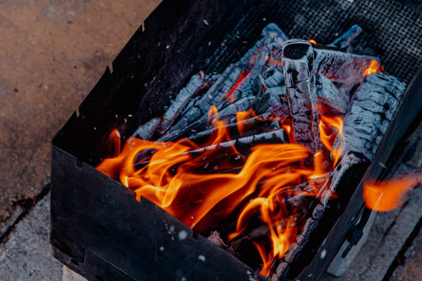 istock Fire, sparks and coals in the grill 2200890269