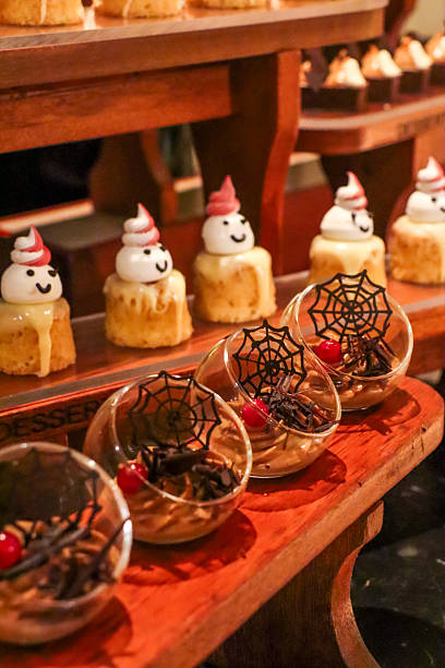 istock Spooky halloween dessert buffet with ghosts, spider web and pumpkin jack-o‘ lantern decorations 2200897207