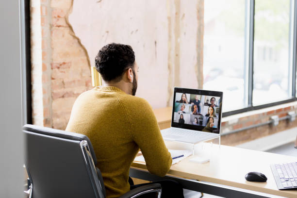 istock Man in Casual Clothing Participating in a Virtual Meeting 2200897702