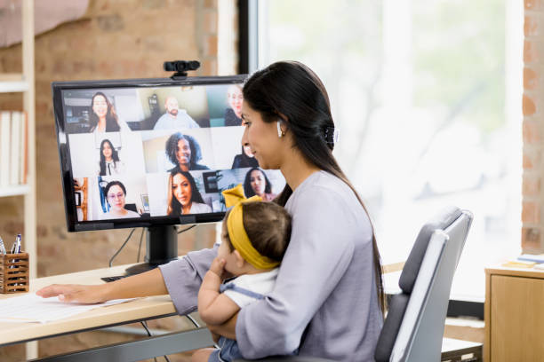 istock Working Mother in Video Conference with Baby 2200897711