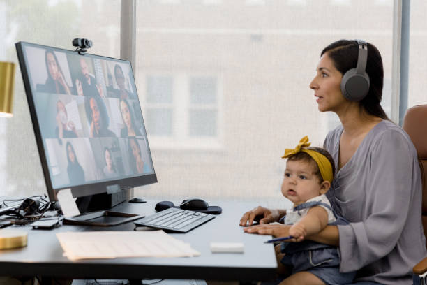 istock Working Mother on Video Conference Call with Baby 2200897756