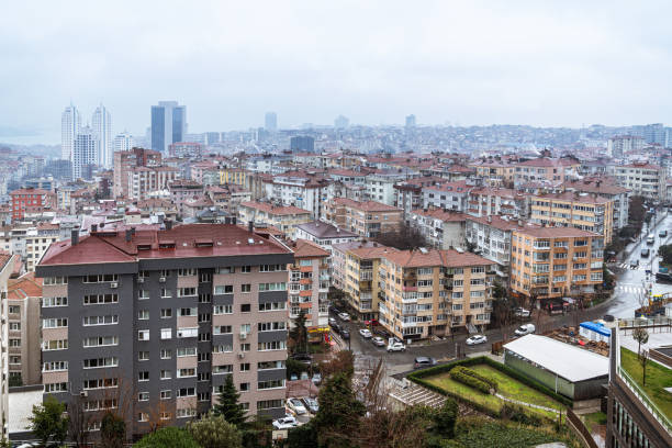 A panoramic view of Istanbul’s evolving architecture, showcasing the contrast between traditional low-rise buildings and modern skyscrapers under a snowy sky. The urban transformation reflects the city’s dynamic growth and architectural diversity