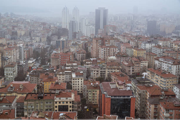 istock Urban Transformation in Istanbul, Modern Architecture, Snowy Cityscape 2200906420