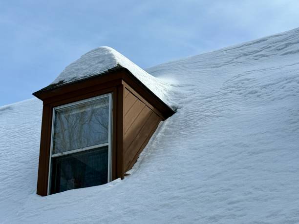 istock Snow on Home Roof and Dormer 2200913369