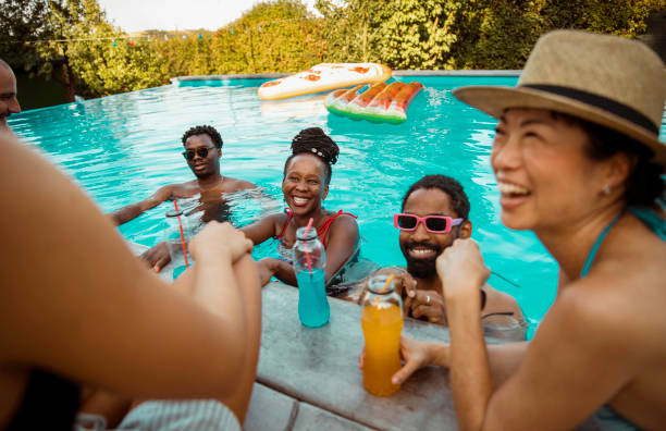 istock Cheerful friends at the pool party 2200915437