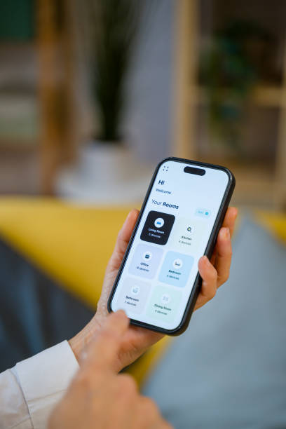 istock Woman managing smart home devices using phone app 2200923278