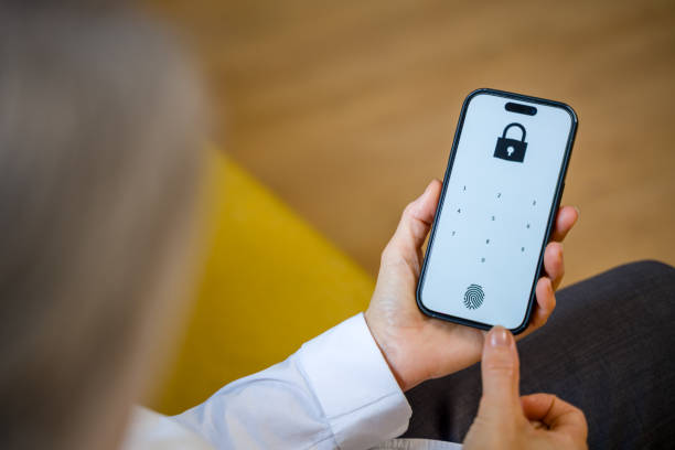 istock woman using fingerprint to unlock mobile phone for security 2200924059