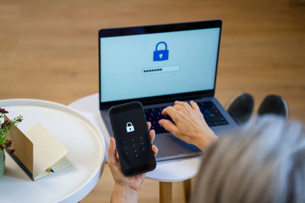 istock Woman typing password on laptop and smartphone for two-factor authentication 2200926844