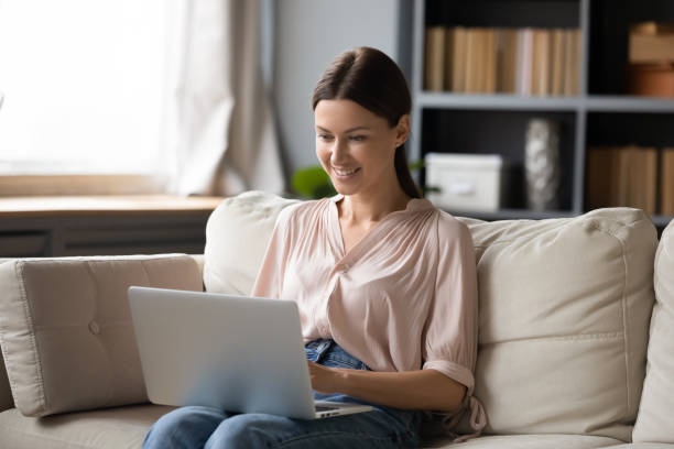 istock Woman spend weekend at home using laptop and internet 2200928807
