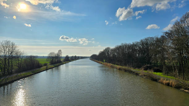 A Beautiful and Serene River Landscape Set Beneath a Bright and Clear Blue Sky on a Peaceful Day