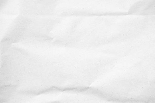 istock White recycled craft paper texture as background. Grey paper texture, Old vintage page or grunge vignette of old newspaper. Pattern rough art creased grunge letter. Hardboard with copy space for text. 2200929729