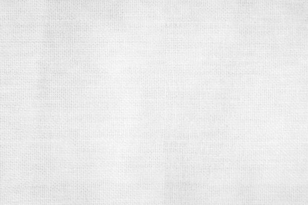 istock White color fabric canvas woven texture background in pattern light blank. Natural gauze linen, carpet wool and cotton cloth textile textured as clean empty for decoration text. Grey sack material. 2200929734