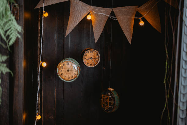 istock Vintage clocks and rustic decor create a cozy atmosphere in a dark setting 2200929828