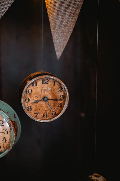 istock Wall clocks hanging as decorative accents in rustic setting at a vintage market 2200929843