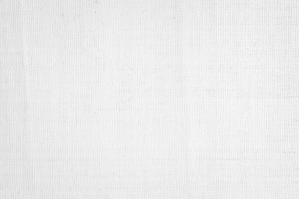 istock White color fabric canvas woven texture background in pattern light blank. Natural gauze linen, carpet wool and cotton cloth textile textured as clean empty for decoration text. Grey sack material. 2200930339